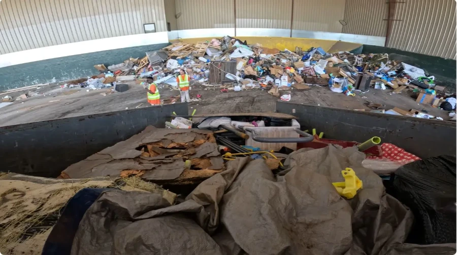 Junk removal in progress at a Peoria home — crew carrying and loading items