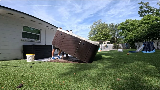 Hot tub being shifted and moved for removal in Peoria, IL